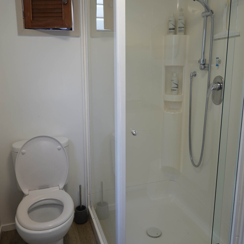The separate "outhouse" has shower and toilet